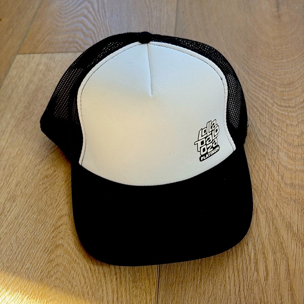 NEW Lollapalooza cap with adjustable back. One size fits all. Black and white